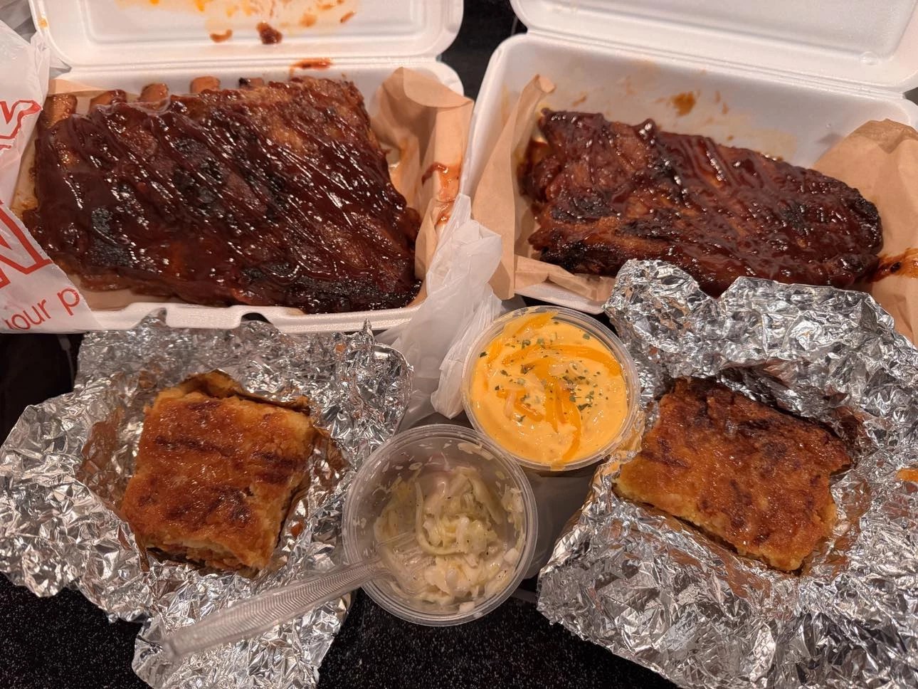 Takeout ribs, cornbread and sides